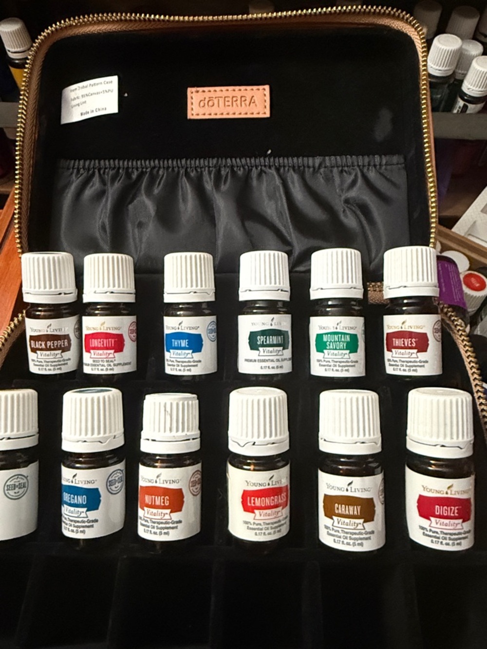 Doterra Black Travel Case with Gold Zipper and 12 new sealed Young Living oils